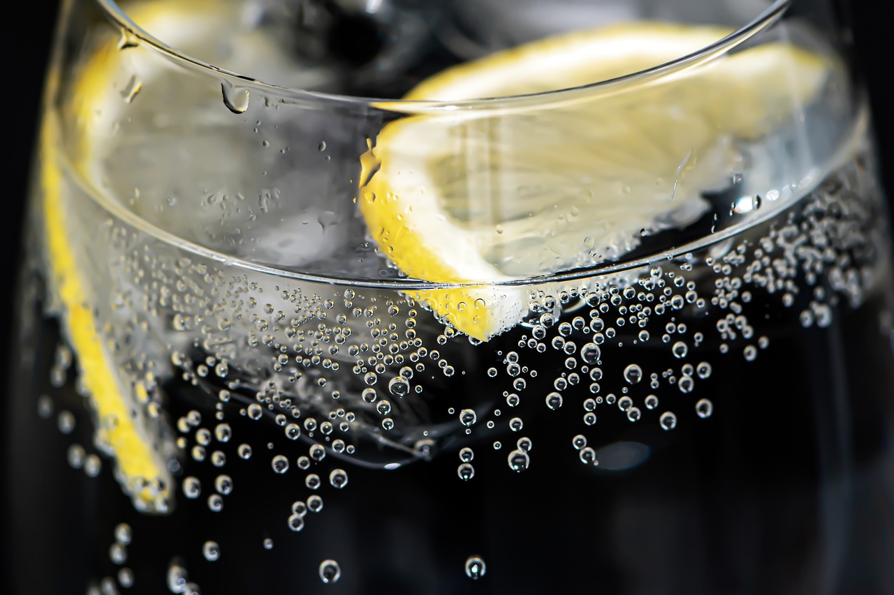 Sophisticated still life of whiskey in a glass against a dark background, capturing the essence of refinement.